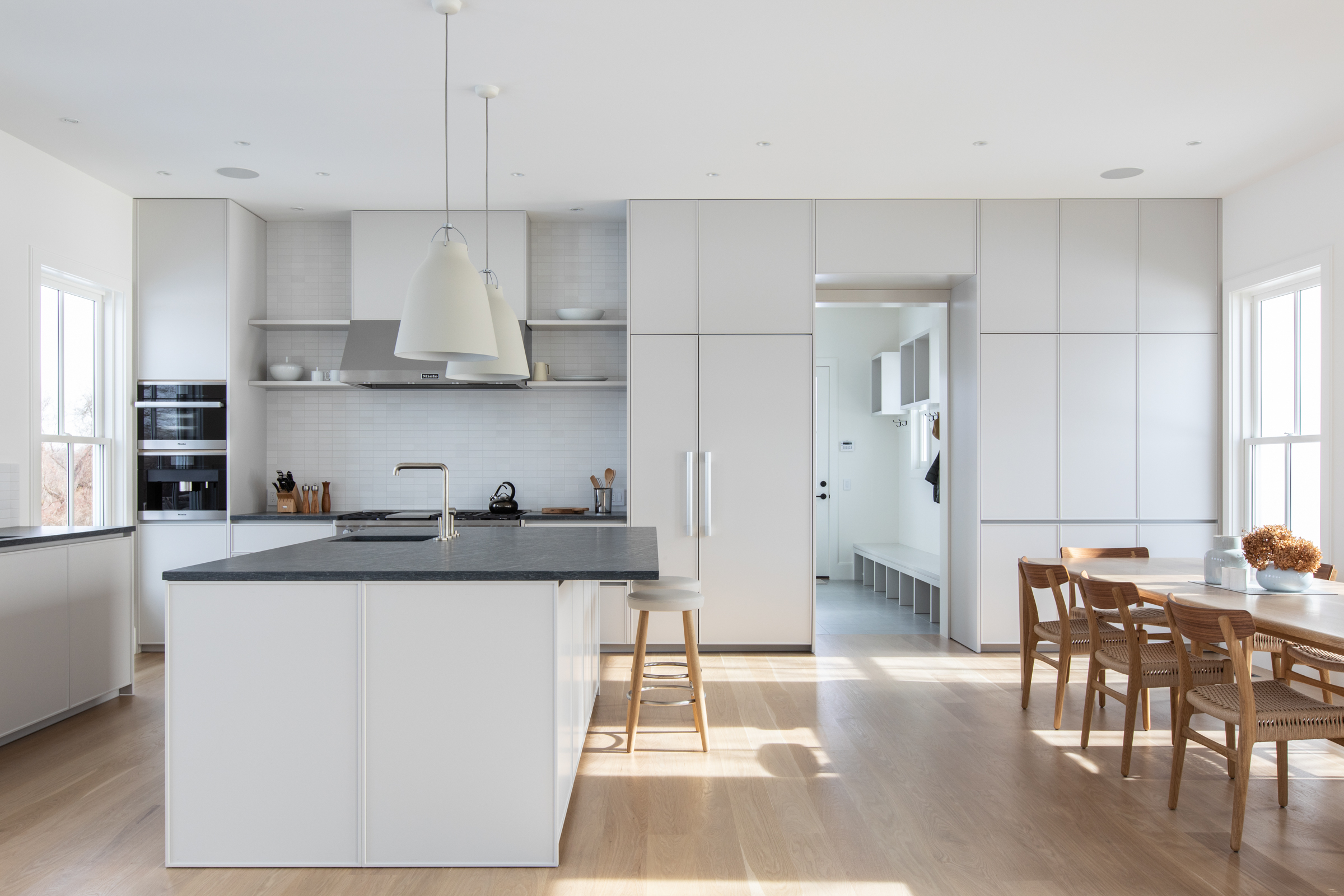 Versilia kitchen — bright open-plan kitchen with island and professional range